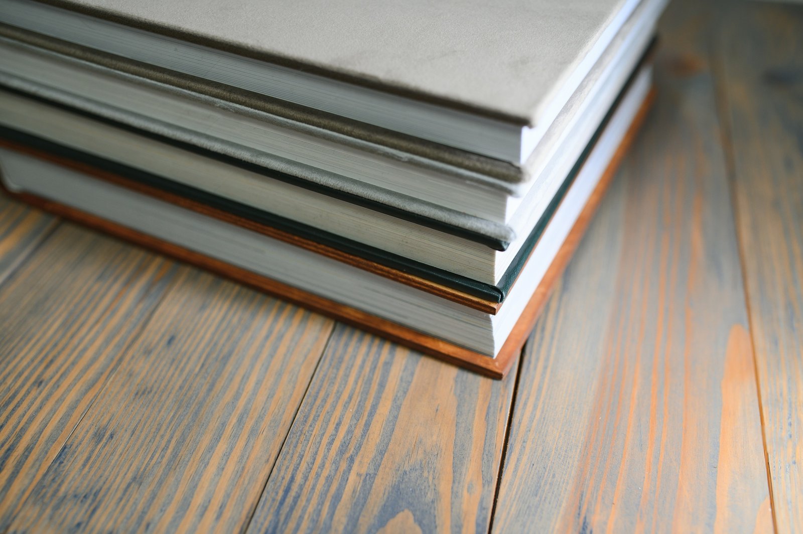 photobooks stacked on top of each other. the concept of making books and albums from photos